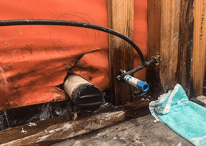 rotten timber wall framing and dux qest pipe