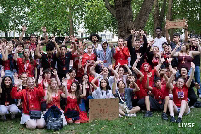 Students dressed in red for the 66th annual London International Youth Science Forum (LIYSF)