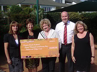 BNI Business Brunch members present a cheque for $11,079.50 to Hospice South Auckland.