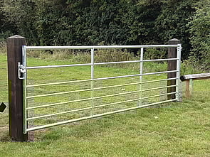 This is a 12' metal field gate hung from timber posts. Ideal for vehicle access into playing fields allotments etc. Has an automatic gate keep that allows a padlock to be fitted.
