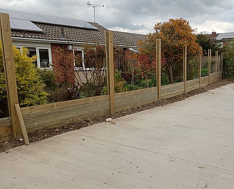 Acoustic fence, build up of the T&G boards on the fence posts.