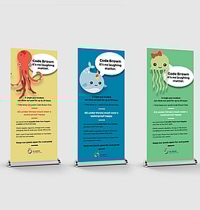 Kaz - Design. Brand. Web creating pull up banners for Taupo District Council