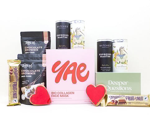 NZ selfcare gift box with facemasks, chocolate brownie, and a card game