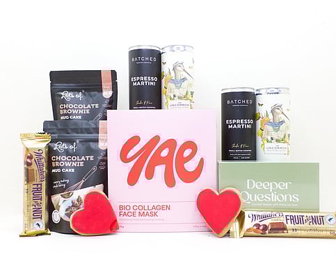 NZ selfcare gift box with facemasks, chocolate brownie, and a card game