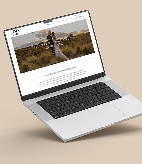 Laptop mockup displaying the Blink Photography website, on a beige background.