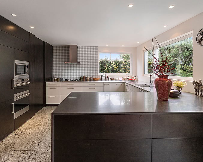Ols Mill House Kitchen with a combination dark brown and white cabinetry.