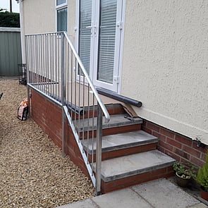 Completed brick steps and handrail for Mobile home.