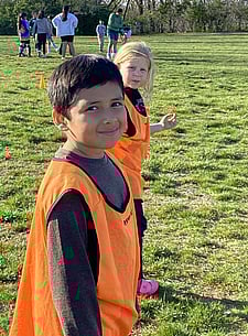Two youth soccer players looking at camera during a break in the game