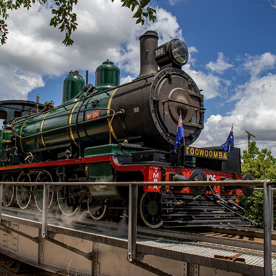 Kids and Man posing at an aircraft at the Hinkler Hall of Aviation