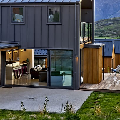 Two storied home in Jacks Point clad in alpine tray and cedar with a second story balcony area.