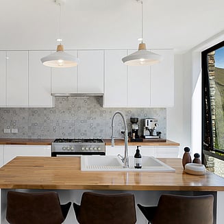 Looking out the front sliding door into the garden from the kitchen area.