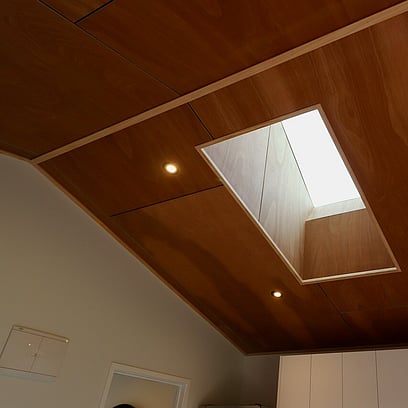 Timber ceiling with a skylight allowing ample natural light into the home.