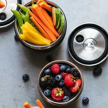 Fresh fruit and vegetables in containers.