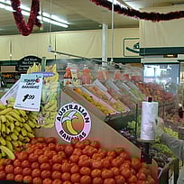 Fresh fruit and vegetables misted in supermarket