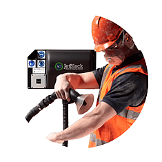 Man stepping out of a personnel cleaning booth in full PPE gear (air blower technology in background)