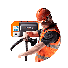 Man stepping out of a personnel cleaning booth in full PPE gear (air blower technology in background)