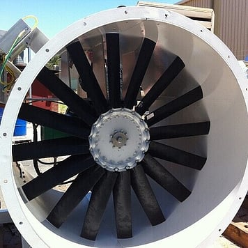 large industrial centrifugal fan in white casing