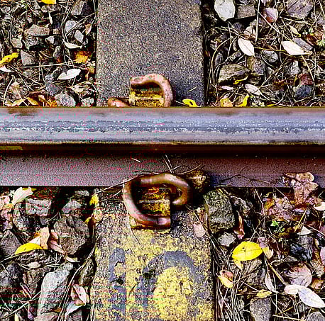 rail track before it is cleaned using PlasmaTrack rail cleaning system. The black teflon like residue is from compressed dried leaves