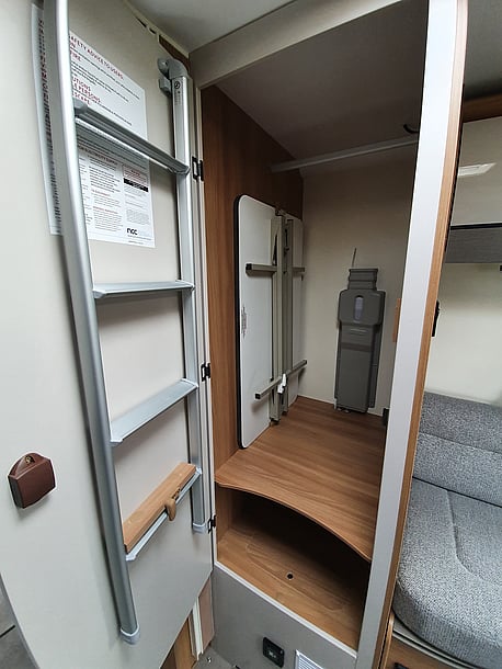large wardrobe, with hanging rail, with outside table, which also fits into rear lounge