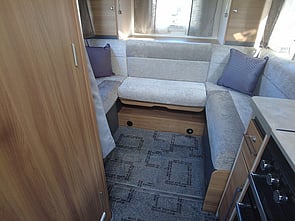 veiw of rear lounge, with 3x windows, with drop down bed above.