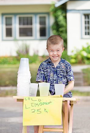 little boy with a lemonade stand