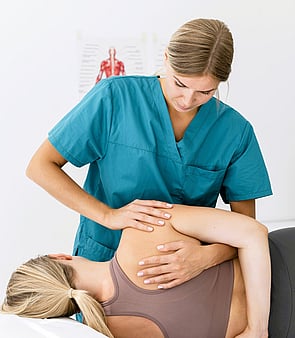 Physiotherapist providing physio to a client