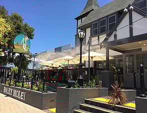 Misting system cooling an outdoor ng at restaurant