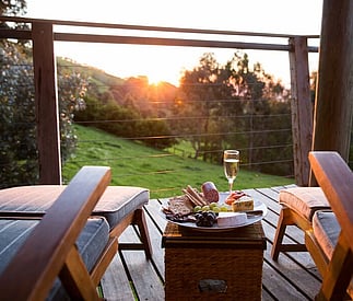 Relaxing deck chairs set up for the sunset at Taronga Cottage