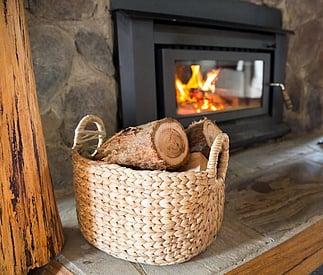 Cosy wood fire and log basket