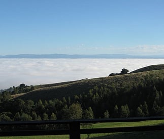 autumn morning with fog in the vally and claer views to mountains