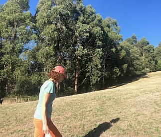 person walking in the paddock below cottae