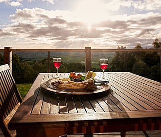 sunset with wine and cheese on the deck