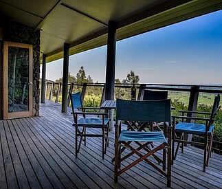 outdoor dining on deck with views below