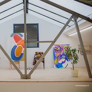 Featured in this photo is the 'Skyline' studio; bright, spacious, high ceiling with skylights. Sizes range from 300 - 520 sqft. 