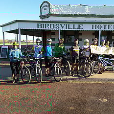 Birdsville Hotel with group of Outbike cyclists