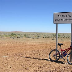 Bicycle near Outback sign