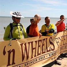 Karumba - finish point for the ride - the group holding banner