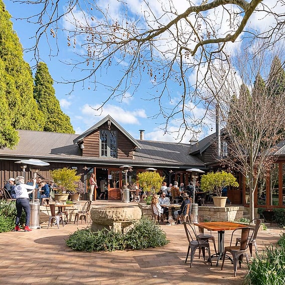 Rustic Venue with People Dining Outside