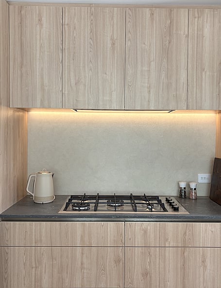 A custom microcement splashback created by the team at Pro Stop Interiors Queenstown