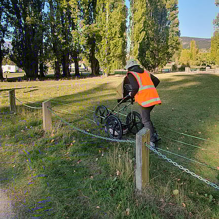 Scientist surveying cemetery