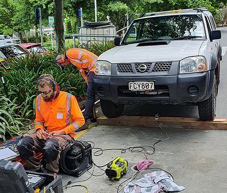 Scientist performing Downhole testing with a hammer