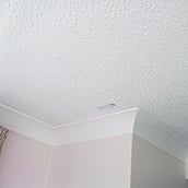 Asbestos containing decorative coating