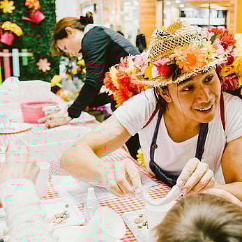 Man wearing Straw Hat leading Activities