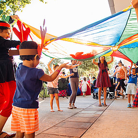 Children with Reindeer Ears Playing with Parachute