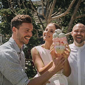 A bride and groom enjoying a Kūaotunu killer ice cream from the Kūaotunu store