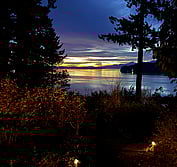 3D Model: View from South showing new beach house design in context with beach, slope and adjacent houses.