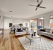 View looking onto wood decked veraInterior view showing kitchen, dining and living area with hardwaood flooring and marble benchtops.Living Room extension and veranda.