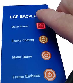 Backlit keypad being pressed