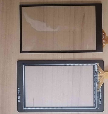 Capacitive touchscreen with front panel surround