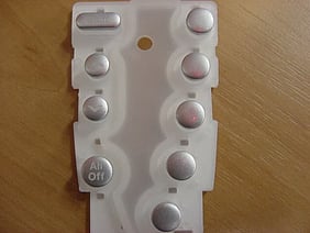 Silicone keypad with metalized keycaps